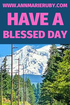 a pink poster with the words have a blessing day in front of a snowy mountain