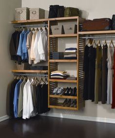 an open closet with clothes and shoes on shelves