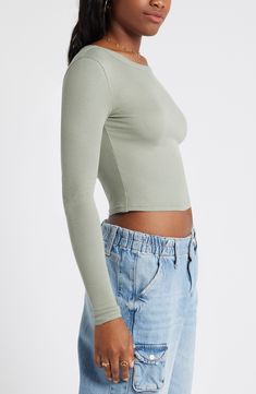 Svelte and stretchy, this finely ribbed crop top is the perfect match for high-rise styles and is polished off by a graceful scoop neckline. 17 1/2" length (size Medium)   Scoop neck   Long sleeves   97% Lenzing™ EcoVero™ viscose, 3% spandex   Lenzing EcoVero viscose is a sustainably produced fiber using pulp made from renewable wood sources and certified with the EU Ecolabel for high environmental standards, including lower emissions and water usage than generic viscose   Machine wash, dry flat Solid Color Crop Top For Fall, Fitted Trendy Crop Top, High Stretch Solid Color Crop Top For Spring, Crew Neck Elastane Crop Top With Stretch, Fitted Cropped Top In Solid Color, Fitted Cropped Top, Fitted Scoop Neck Solid Color Top, Fitted Solid Color Scoop Neck Top, Ribbed Fitted Crop Top