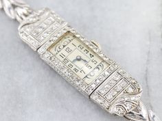 This Retro Era ladies wrist watch is crafted of platinum and white gold, and inlayed with diamonds. The glittering diamonds turn this from a time piece into a piece of fine ladies jewelry. This beautiful ladies wrist watch is in excellent condition and, like all of our watches, has been restored and cleaned by a master watch craftsman. The original quartz movement and band has been replaced. We left the original engraving on the reverse "BERTHA E. GILSON" as a sentiment to its history! Materials Art Deco Ladies, Ladies Wrist Watch, Watch Art, Retro Era, Antique Watches, Watch Vintage, Beautiful Ladies, Women Wrist Watch, Diamond Watch