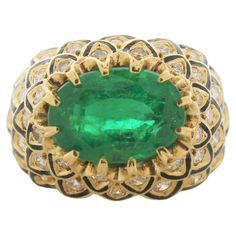 This unique 18K yellow gold diamond has sparkling round brilliant cut diamonds that total up to 1.00 carats. At the center of a ring is an oval emerald weighing 3.71 carats. This ring is sure to make a statement. Emerald And Diamond Ring, Emerald Diamond Ring, Oval Rings, Emerald Diamond, Round Brilliant Cut Diamond, Brilliant Cut Diamond, Birthstone Jewelry, Cocktail Rings, Luxury Jewelry