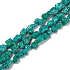 three strands of turquoise green beads on a white background