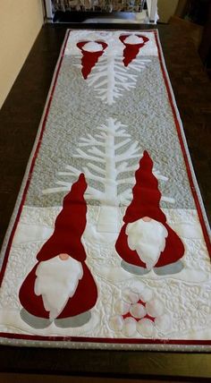 a table runner with santa hats on it