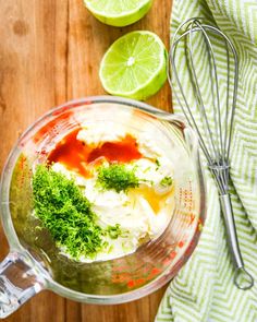 a blender filled with mashed cauliflower and limes