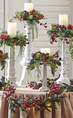 christmas decorations with candles and greenery