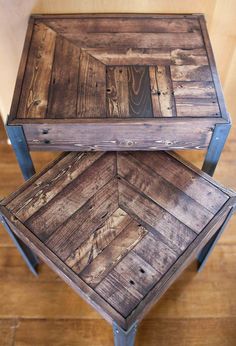 two wooden tables stacked on top of each other in the middle of a wood floor