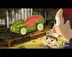 a man holding a small child in front of a cartoon car