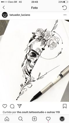 an image of a skull with roses on it and a pen in the foreground