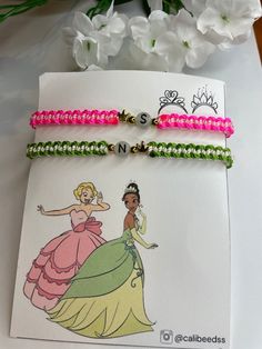 the princess and the frog bracelets are on display