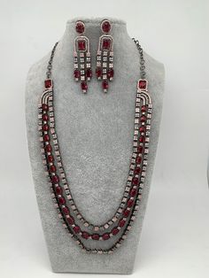 AD Wine Red Stone Multi Layer Victorian Finish Long Necklace with Matching EarringsColor : VictorianSize : Necklace Length : Approx 24 Inches; Earring Length : 2.75 inches;Stones : AD Wine Red Stone Red Metal Jewelry Sets For Party, Necklace Traditional, Traditional Necklace, Red Stone, Social Events, Necklace Length, Wine Red, Indian Jewelry, Multi Layering