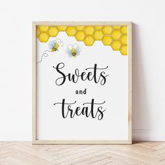 a sign that says sweets and treats with bees on the front, next to a wooden floor