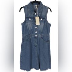 Nwt Joie Denim Collared Sleeveless Button Up Jean Mini Dress Raw Hem Size M Sleeveless Button Up Denim Dress. Distressed Hemline On Bottom. Includes Pockets In Front And Back At Hips. Collared Neck. Belt Loops. Super Cute !! Fast Shipping Welcome Offers & Counteroffers Item Stored In A Place Free Of Smoke And Pets Feel Free To Send Me Any Questions Please Review All Photos And Zoom In To See The Exact Condition, Details And Measurements Idiomas/Languages. Espaol / English You Can Visit My Closet Casual Denim Sleeveless Vest With Snap Buttons, Sleeveless Medium Wash Denim Dress, Trendy Sleeveless Denim Vest With Snap Buttons, Sleeveless Cotton Denim Dress, Sleeveless Denim Jumpsuit With Buttons, Trendy Sleeveless Denim Vest With Button Closure, Spring Sleeveless Denim Jumpsuit In Denim Blue, Sleeveless Denim Top With Button Closure For Summer, Sleeveless Denim Dress With Pockets