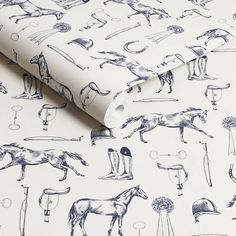 a white wallpaper with horses and jockeys on it's back ground, next to a lamppost