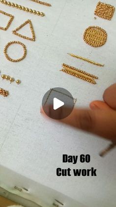 someone is working on some gold jewelry in their box with the words day 60 cut work