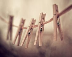 clothes pins are hanging on the clothesline and there is no image here to provide a caption for