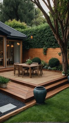 a wooden deck in the middle of a yard