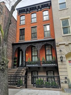 an apartment building with wrought iron railings and balconies