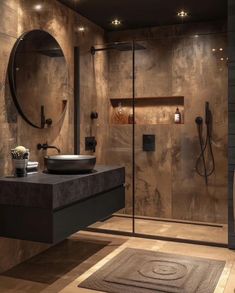 a bathroom with a sink, mirror and shower stall in it's center area