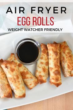 air fryer egg rolls on a plate with dipping sauce