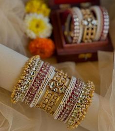 Description :- Kundan Bangles, Gold Plated Bangles, Polki Bangle, Bridal Polki Bangle Set, Bridal Jewelry, Wedding Jewelry, Designer Jewelry Gift yourself a royal look with this perfectly crafted necklace set from Manalisstudio. Crafted with high quality stones and pearls, it is impressive in design. The green enamel artwork adds perfect texture to the design. Perfect for weddings and festivities, this antique Chuda set should be put on with your favorite sari or lehenga. 100% Satisfaction. Long White Bollywood Bangle For Wedding, White Bangle For Wedding And Diwali, Wedding Bangle With Latkans For Diwali, Wedding Diwali Bangle With Latkans, Heavy White Bracelets For Festive Occasions, White Wedding Bangle For Diwali, Bollywood Style White Wedding Bangle, White Bollywood Style Wedding Bangle, White Wedding Bangle For Festive Occasions