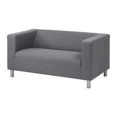 a gray couch sitting on top of a white floor