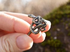 "Handmade sterling silver or bronze snake ring.  Dear customer, please keep in mind that bronze sometimes reacts with the skin and can leave a green \"mark\" under the ring. The good news - it is completely harmless and washable. In ancient times the Snake was worshiped as a dainty of house warm, giver of happiness, health, and well-being. As snakes change their skin, they are also considered a symbol of transformation, rebirth, and healing. PRODUCT DETAILS - Max. height: 21 mm/ 0.83\" - Width o Unique Hand Forged Snake Ring, Unique Handmade Metal Snake Ring, Unique Hand Forged Snake Ring As Gift, Unique Hand Cast Snake Ring As Gift, Unique Hand Cast Snake Ring Gift, Handmade Metal Snake Ring As Gift, Bronze Snake-shaped Jewelry Gift, Bronze Snake Shape Jewelry As Gift, Bronze Snake-shaped Jewelry For Gift