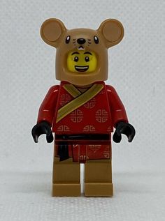 a lego bear is wearing a red outfit