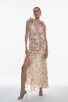 Whether A Romantic Date Night Or Spring Soiree, This Maxi Dress Promises To Captivate. Adorned With Elegant Ruffles Along The Hemline And Bodice, This Dress Exudes Feminine Allure, While A Pastel Petal Print Encompasses An Optimistic Mood. Statement Rosette Shoulder Details And An Open Back Design Add A Fashion-Forward Finishing Touch.Rosette Shoulder Detailsopen Back Designfloral Motifsruffle Hemlineplunge V-Neckline Spring Soiree, Slip Maxi Dress, Intricate Beading, Occasion Outfit, Romantic Date Night, Occasion Wear Dresses, Romantic Date, Sequin Party Dress, Maxi Dress Navy