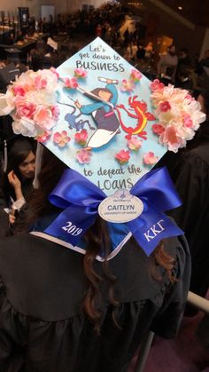 a woman wearing a graduation cap with flowers on it