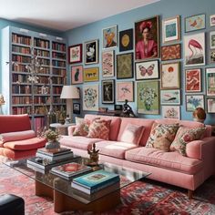 a living room filled with furniture and lots of pictures on the wall