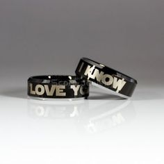 two black and white rings with words on them