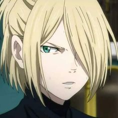 an anime character with blonde hair and green eyes looks at the camera while staring into the distance