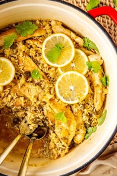 chicken and rice with lemons in a skillet