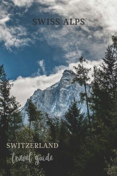 there is a mountain in the background with trees around it and text that reads swiss alps