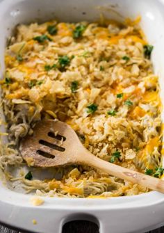 a casserole dish with chicken, rice and parsley