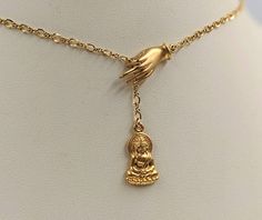 "This meaningful, unique necklace is a 925 Sterling Buddha pendant plated with 24K gold and matching hand of Fatima. Chain is Upgraded 14k gold filled infinity. Item specifics: Length: select (contact us for unlisted lengths) Buddha Charm: approx. 13mm gold Vermeil (925 sterling plated with 24K gold) Hand: approx. 20mm gold Vermeil Chain: approx. 2mm Your Necklace ALSO COMES WITH: 1. A custom BellaIpsa jewelry box -- see pictures throughout the site! 2. A BellaIpsa bookmark with more details abo