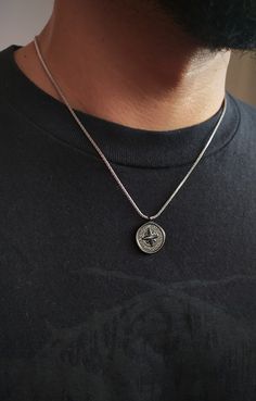 This necklace is composed of stainless steel compass pendant and box chain, a very durable and fashionable piece that compliments any outfit. Perfect gift for him! ✺ Waterproof ✺ Chain width: 2 mm ✺ Pendant length: 0,8 inch / 2 cm Available in various lengths. Measure your desired length and order accordingly.  How to find the perfect length for you: ❉ Use a soft measuring tape or a string to mark where you would like the necklace to hang ❉ Then measure the string's length with a ruller If you are not sure, please contact me so I can give you instructions. ❈ We send all our items with registered and tracked mail. ✺ All items come packaged in a quality pouch ready for gift giving. ✽ If you want to make a special order, just contact us! Necklaces For Necklines, Necklace For Neckline, North Star Necklace, Compass Pendant, Perfect Gift For Him, Necklace For Men, Necklace Black, Measuring Tape, Steel Necklace