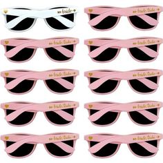 six pairs of pink and black sunglasses with gold hearts on the side, each pair has two