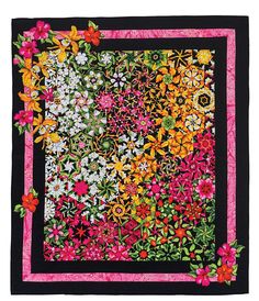 a black and pink square quilt with flowers on the border, in front of a white background