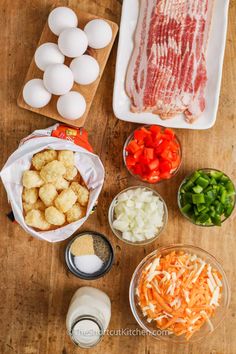 the ingredients to make this dish are laid out on a wooden table