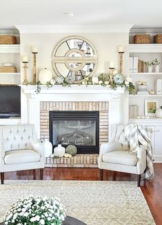 a living room filled with furniture and a fire place in front of a flat screen tv