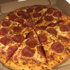 a large pepperoni pizza in a box