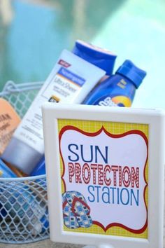 a sign that says sun protection station in front of a basket full of sunscreens