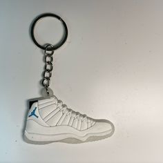 These Nike Shoe Keychains are perfect for sneaker enthusiasts, collectors, and anyone looking to add a touch of style to their keys or backpacks. They make excellent gifts and can even be attached to matching pairs of shoes. These keychains are both durable and stylish, catering to sneakerheads and collectors alike. Keychain Size: 5cm by 3.5cm Available Models: Jordan 11  Also Available  Jordan 1 Jordan 2 Jordan 3 Jordan 4 Jordan 6 Jordan 7 Jordan 11 Jordan 12 Jordan 13 Shoe Keychains, Matching Pairs, Nike Shoe, Jordan 7, Jordan 12, Jordan 2, Jordans 12, Jordan 6, Jordan 13