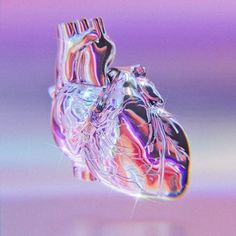 an image of a heart that is in the air with water on it's surface