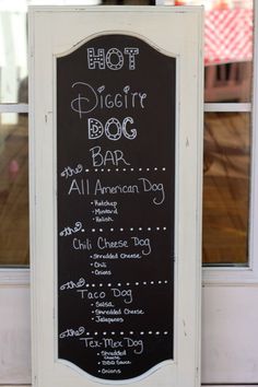 a chalkboard sign that says hot dog bar