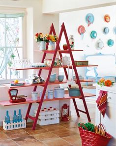 a red ladder shelf filled with lots of items