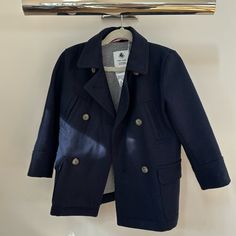 This Never Worn Absolutely Adorable Petit Bateau Pea Coat Can Be Yours! Navy, 100% Cotton, Fully Lined With Navy And White Stripes, Faux Tortoise Button Closure Lost In A Closet And Now Found Is Ready For The Holidays! Navy Peacoat For Spring, Navy Peacoat With Button Closure For Spring, Classic Navy Peacoat For Spring, Blue Pea Coat With Buttons For Spring, Blue Spring Pea Coat With Buttons, Blue Spring Pea Coat, Blue Long Sleeve Peacoat With Buttons, Casual Blue Double-breasted Peacoat, Blue Pea Coat With Pockets For Spring