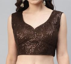 ITEM DESCRIPTION Beautiful Women's Sequined Padded Customize Blouse For Saree Lehenga Skirt Top Sale For:-1 Blouse Fabric:-Georgette  Closure Type:-Back Hook & Eye With Dori Sleeves Type:-Sleeveless Neck Style:-Sweetheart Neck  Product:-Padded Blouse With Pure Cotton Inner Lining along with Margins for X Tensions are also provided Care Instructions:-Hand Wash & Machine Wash only Work:-This is a Fully Stitched Designer Piping & Sweetheart Neck blouse Disclaimer:-The Actual Color Of The Product Slightly Vary From The Image Due To Photographic Light Or Monitor's Display. CUSTOMIZE:-YOU CAN CUSTOMIZE YOUR SIZE BY CHOOSING A CUSTOM OPTION TO GIVE SIZE VARIATION AND AFTER PLACING THE ORDER GIVE US FULL MEASUREMENT BY MAIL. About This Item Ethnic Sequined Georgette Designer Blouse To Give Yoursel Sleeveless Georgette Party Blouse, Festive Georgette V-neck Blouse Piece, Festive Georgette Tops With Sequins, Festive Georgette Sequin Tops, Sleeveless Georgette Blouse For Festive Occasions, Festive Sleeveless Georgette Blouse, Sleeveless Georgette Blouse For Diwali, Traditional Sequined Tops In Georgette, Party Blouse With V-neck In Georgette