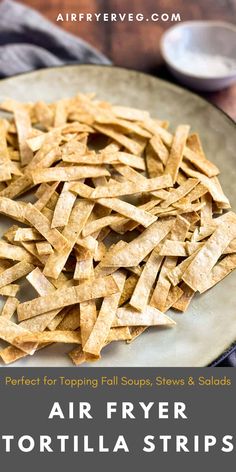 air fryer tortilla strips on a plate with text overlay that says air fryer tortilla strips